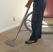 Technician Cleaning Tan Carpet